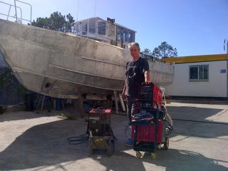 Arne striking a pose in front of his awesome ally boat